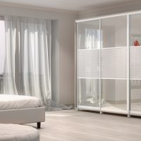 conception d'une armoire d'angle dans une chambre à coucher en bois photo