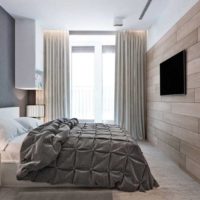 Tons gris et marron dans la conception de la chambre