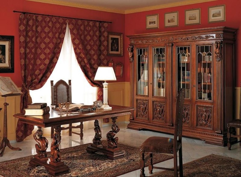 Interior de oficina de estilo renacentista con paredes rojas
