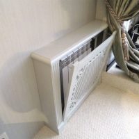 Écran de l'appareil de chauffage avec un panneau articulé