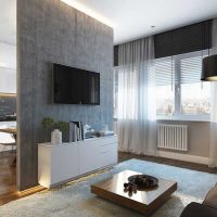Armoire blanche devant une cloison grise