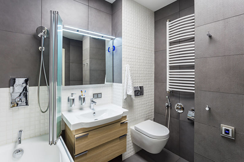 Azulejo gris en el baño con inodoro colgante