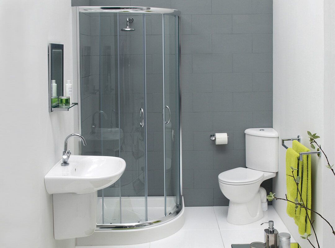 Ducha de esquina con puertas de vidrio.
