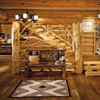Un escalier en bois fait de troncs de pin brut