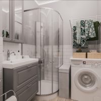 Une machine à laver à côté de la douche
